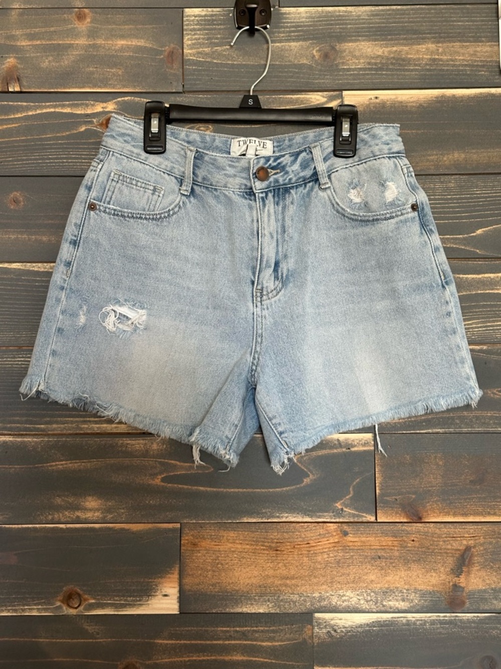 Twelve Light Wash Distressed Denim Shorts